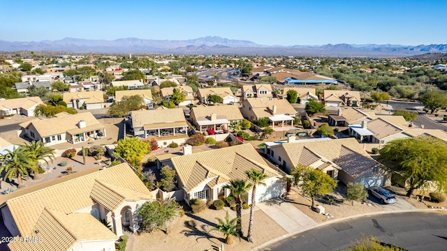 birds eye view of property with a mountain view