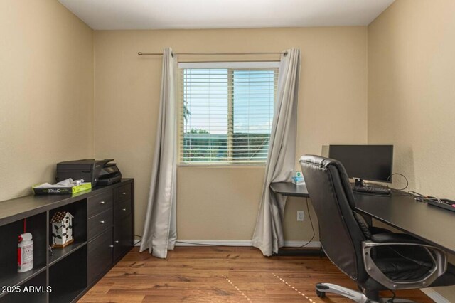 office with baseboards and wood finished floors