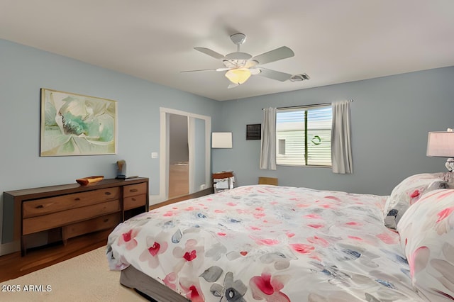 bedroom featuring wood finished floors and a ceiling fan