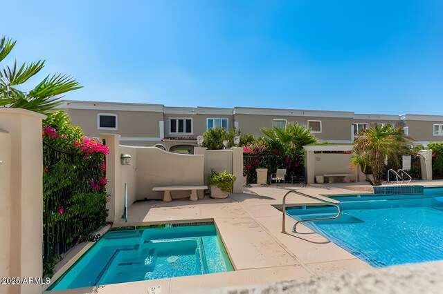 view of swimming pool with a patio area and a fenced in pool