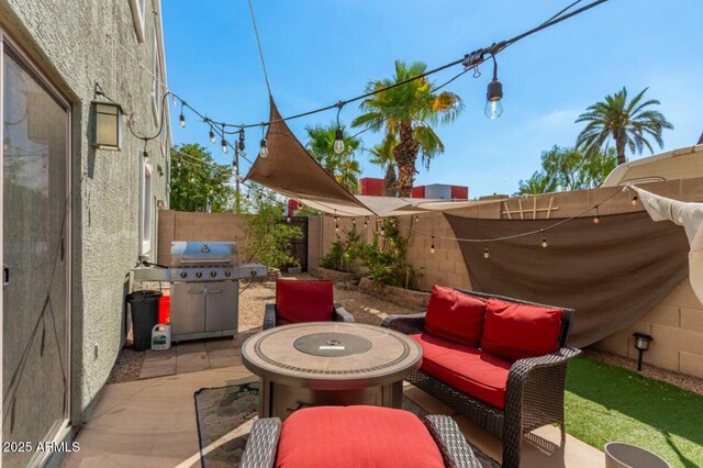 view of patio / terrace with an outdoor hangout area, area for grilling, and a fenced backyard