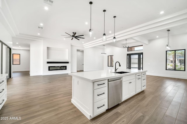 18225 W San Juan Ct, Litchfield Park, AZ 85340 - kitchen with a sink, stainless steel dishwasher, open floor plan, a ceiling fan, and light countertops