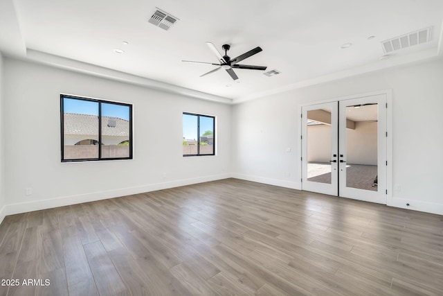 18225 W San Juan Ct, Litchfield Park, AZ 85340 - empty room featuring french doors, ceiling fan, wood finished floors, and baseboards