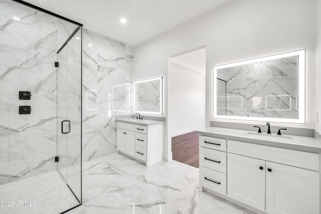18225 W San Juan Ct, Litchfield Park, AZ 85340 - full bathroom featuring a marble finish shower, two vanities, marble finish flooring, and recessed lighting