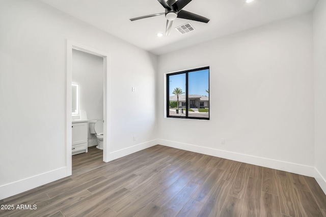 18225 W San Juan Ct, Litchfield Park, AZ 85340 - unfurnished bedroom with baseboards, wood finished floors, recessed lighting, ensuite bathroom, and ceiling fan
