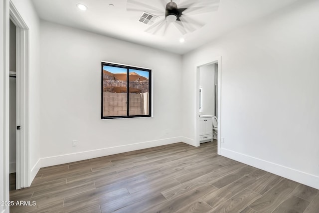 18225 W San Juan Ct, Litchfield Park, AZ 85340 - spare room with wood finished floors, baseboards, ceiling fan, and recessed lighting