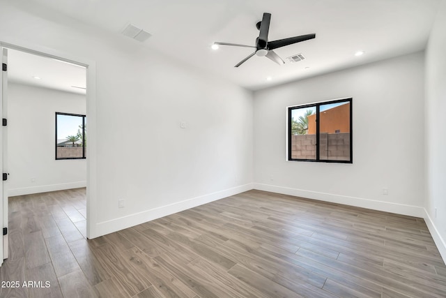 18225 W San Juan Ct, Litchfield Park, AZ 85340 - empty room with ceiling fan, wood finished floors, baseboards, and recessed lighting