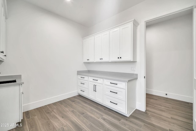 18225 W San Juan Ct, Litchfield Park, AZ 85340 - detailed view of baseboards and wood finished floors