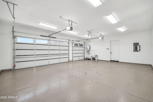 18225 W San Juan Ct, Litchfield Park, AZ 85340 - garage featuring a garage door opener, electric panel, and baseboards