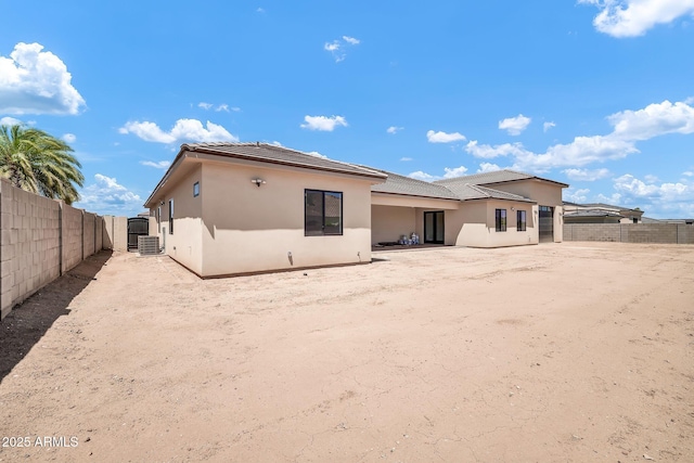 18225 W San Juan Ct, Litchfield Park, AZ 85340 - rear view of property featuring stucco siding and a fenced backyard