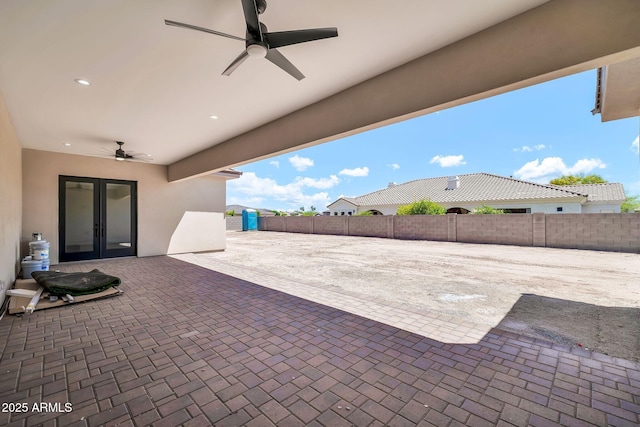 18225 W San Juan Ct, Litchfield Park, AZ 85340 - view of patio with french doors, ceiling fan, and fence