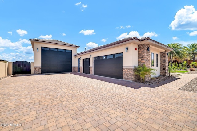 18225 W San Juan Ct, Litchfield Park, AZ 85340 - garage with decorative driveway and a gate