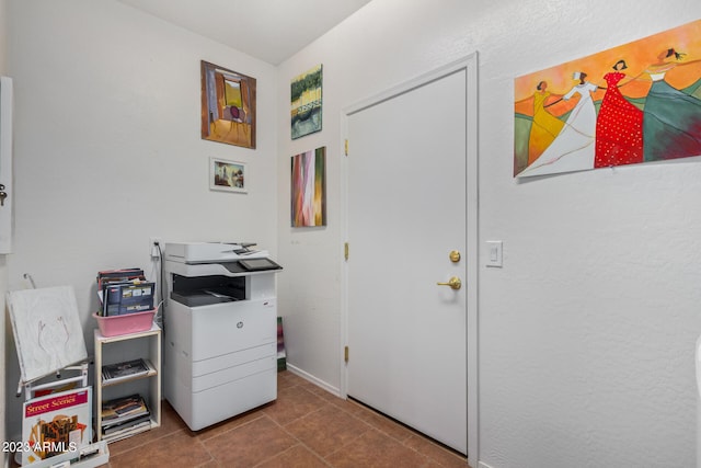 doorway to outside with tile patterned flooring