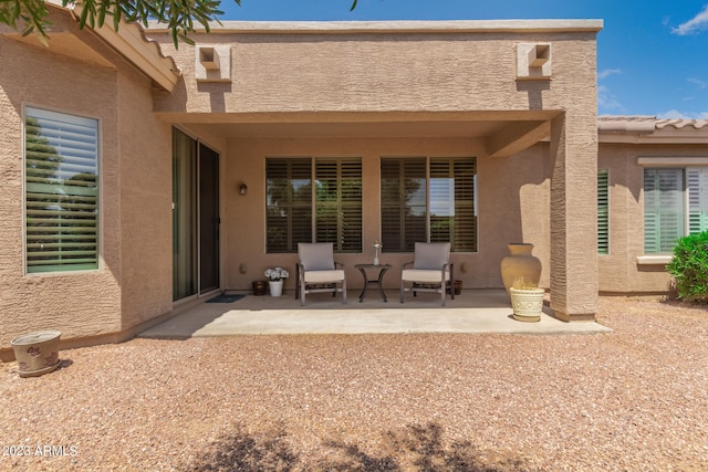 rear view of house featuring a patio area