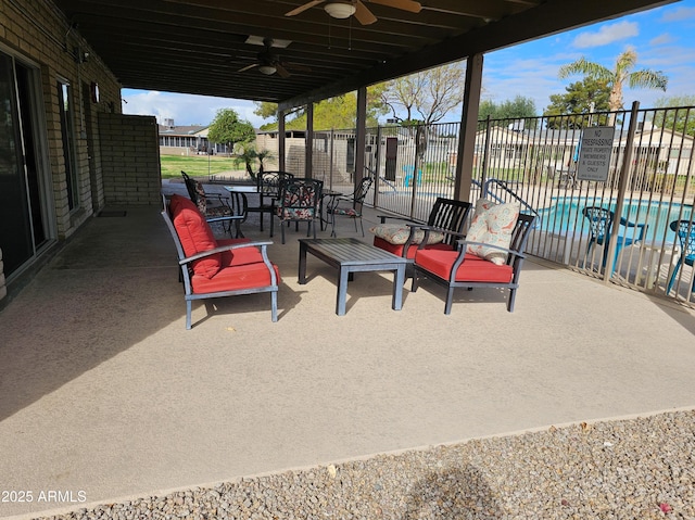 view of patio / terrace with ceiling fan and fence