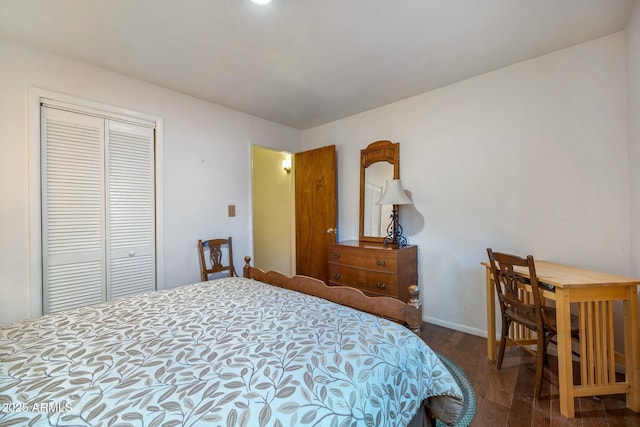 bedroom featuring a closet and dark wood-type flooring