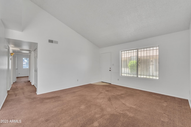 4836 W Rose Ln, Glendale, AZ 85301 - carpeted empty room with baseboards, visible vents, high vaulted ceiling, and a textured ceiling
