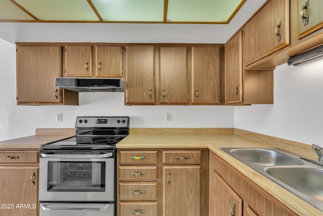 4836 W Rose Ln, Glendale, AZ 85301 - kitchen with light countertops, electric stove, under cabinet range hood, and a sink