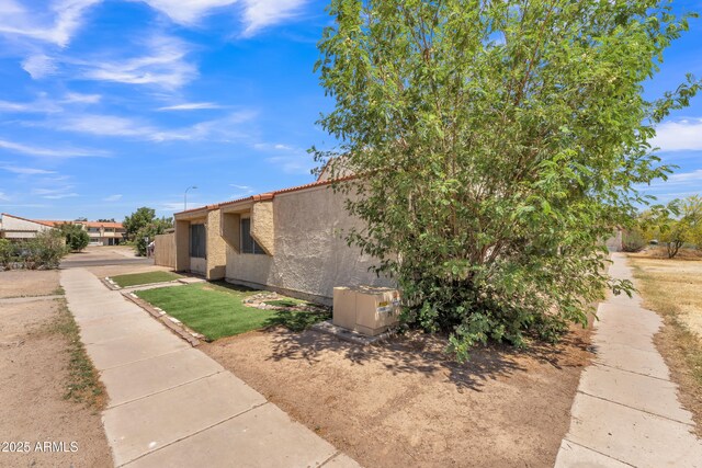 4836 W Rose Ln, Glendale, AZ 85301 - view of home's exterior featuring a tile roof and stucco siding