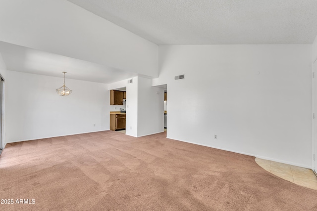 4836 W Rose Ln, Glendale, AZ 85301 - unfurnished living room with light colored carpet, baseboards, visible vents, and high vaulted ceiling