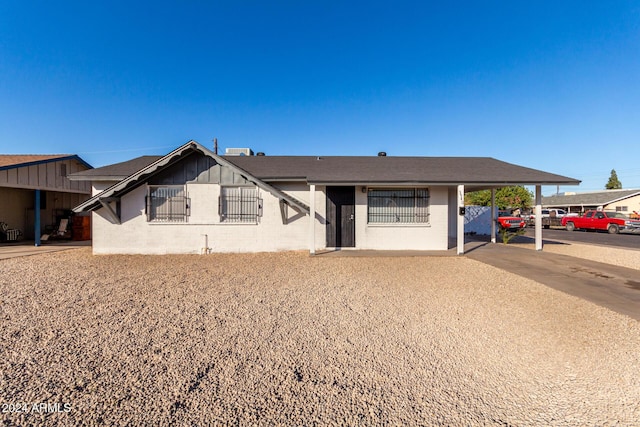 view of front of home with a carport