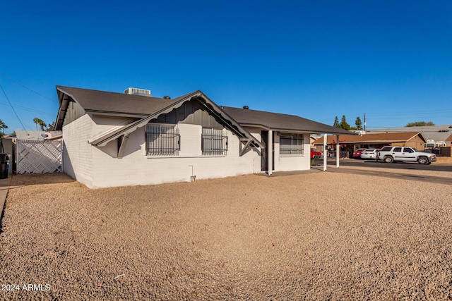 view of front of home with a carport