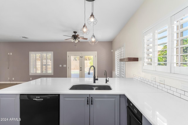 kitchen featuring a wealth of natural light, ceiling fan, sink, and dishwasher