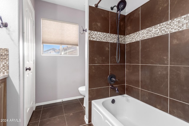 full bathroom with vanity, tile patterned flooring, toilet, and tiled shower / bath combo