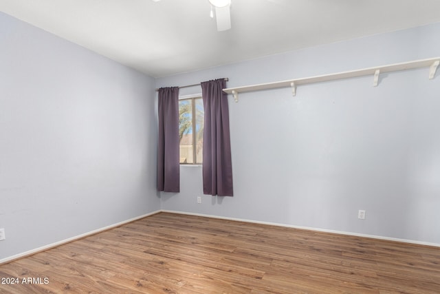 unfurnished room featuring hardwood / wood-style flooring and ceiling fan