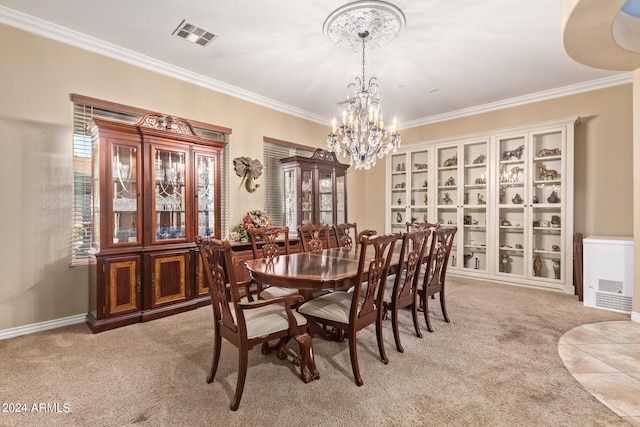 dining area featuring ornamental molding, light carpet, and an inviting chandelier