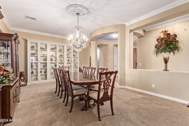 dining space with light carpet, crown molding, and a chandelier