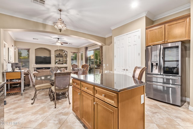 kitchen featuring a kitchen island, stainless steel fridge, ceiling fan, crown molding, and light tile patterned floors