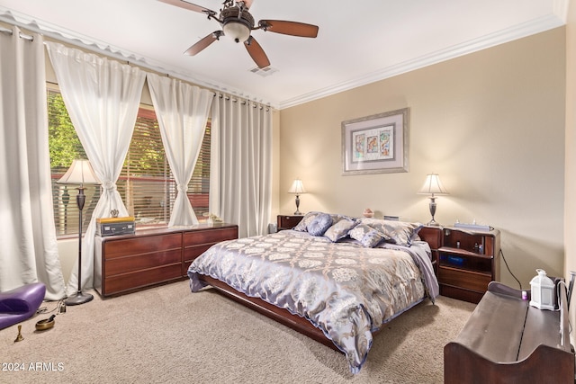 carpeted bedroom featuring ornamental molding and ceiling fan