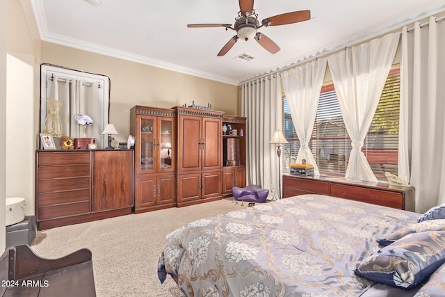 bedroom with crown molding, carpet flooring, and ceiling fan