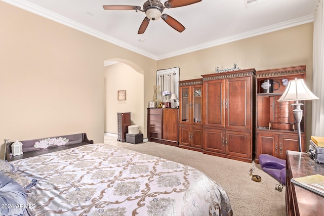 bedroom featuring crown molding, carpet, and ceiling fan