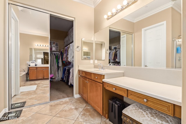 bathroom featuring vanity, ornamental molding, tile patterned flooring, and an enclosed shower