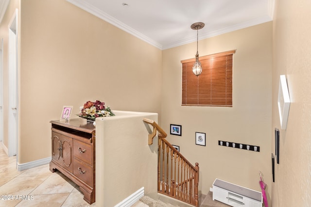 staircase featuring crown molding and tile patterned flooring