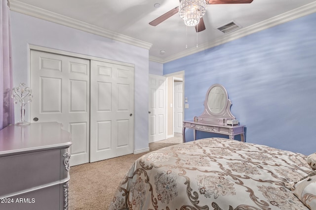 bedroom featuring a closet, ceiling fan, crown molding, and light carpet