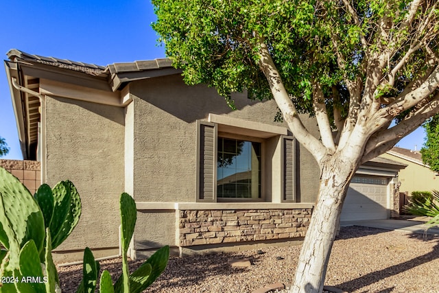 view of home's exterior with a garage