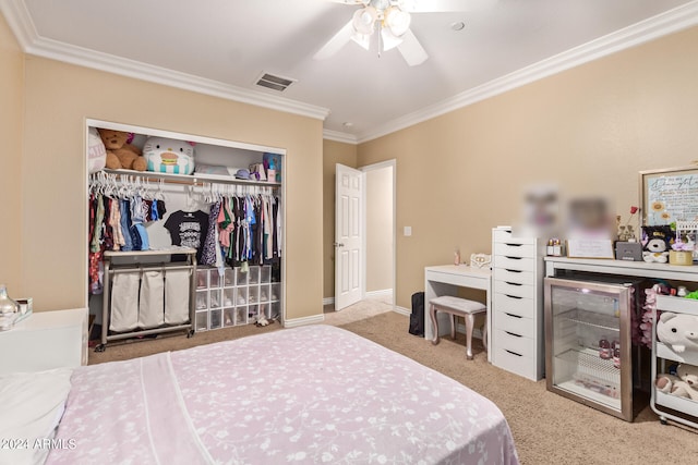 bedroom featuring crown molding, light colored carpet, a closet, and ceiling fan