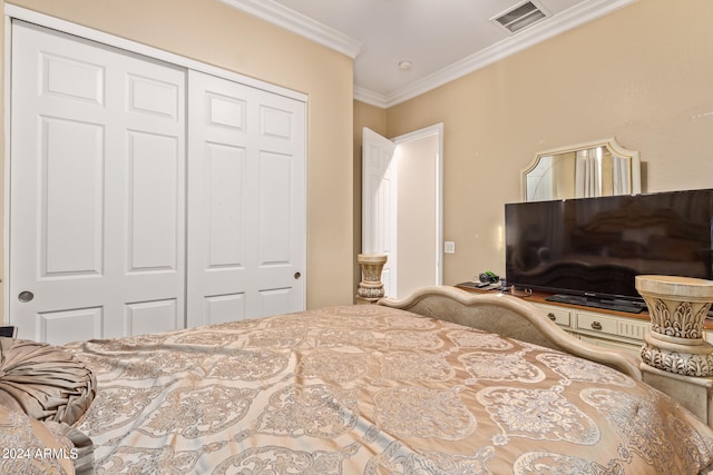 bedroom featuring a closet and ornamental molding