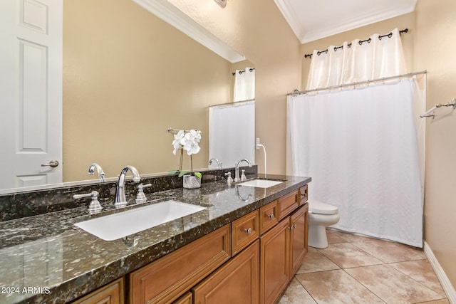 bathroom with toilet, crown molding, vanity, and tile patterned floors