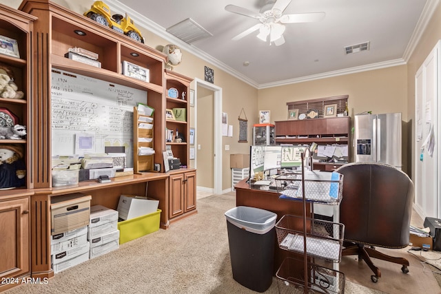 carpeted home office featuring ornamental molding and ceiling fan