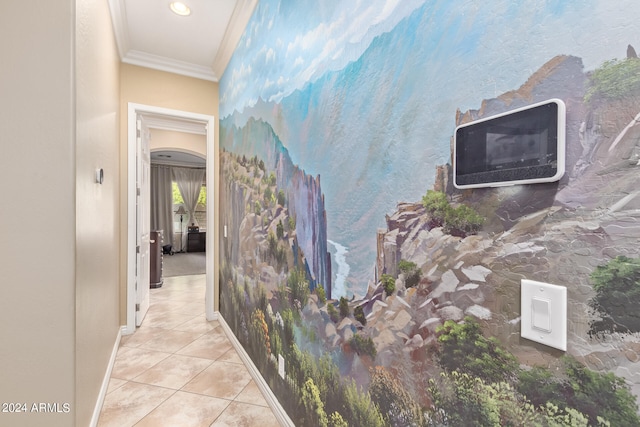 hall with crown molding and light tile patterned floors