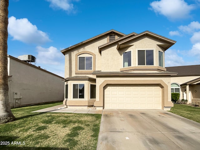 view of front of house featuring stucco siding, an attached garage, a front yard, and driveway