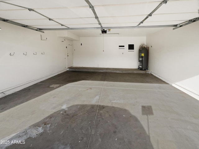 garage with water heater, baseboards, and a garage door opener