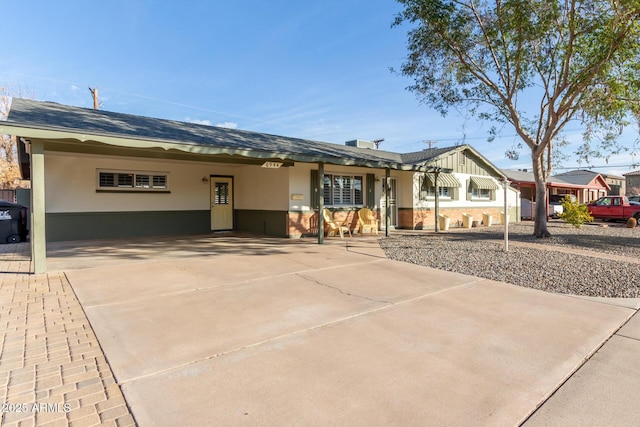 ranch-style home with a carport