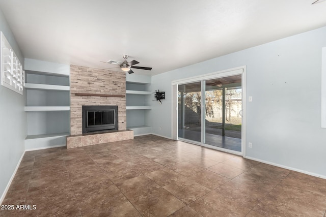 unfurnished living room featuring built in shelves, ceiling fan, and a tile fireplace