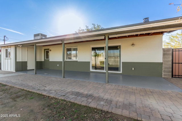 back of property with a patio area