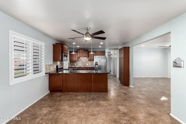 kitchen featuring hanging light fixtures, decorative backsplash, ceiling fan, appliances with stainless steel finishes, and kitchen peninsula